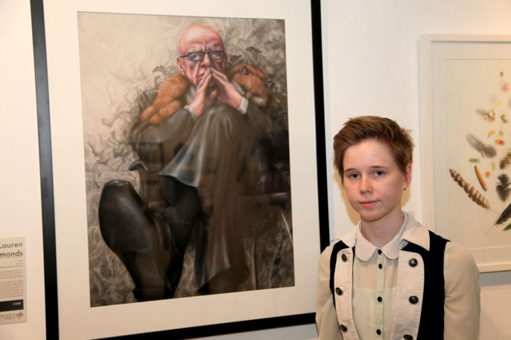 Photo of artist Lauren Edmonds with their work 'Faux' (2014) at Jugglers Art Space