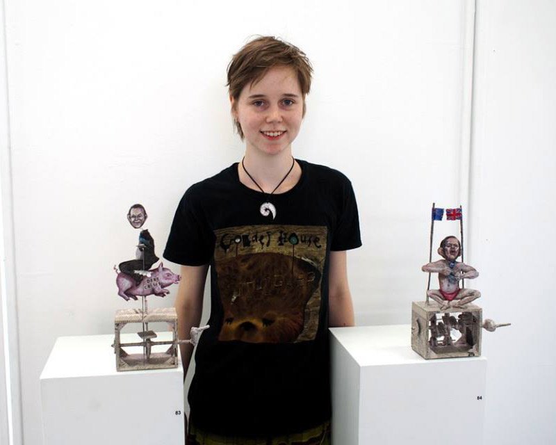 Photo of artist Lauren Edmonds with their work Interactive Automatons by artist Lauren Edmonds
